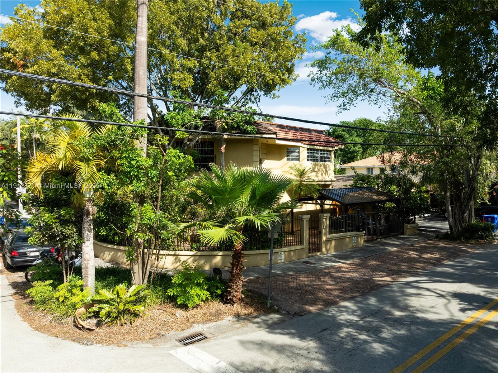2997 Day Avenue Miami, FL 33133 - Photo 11 of 15 a backyard of a house with a garden and outdoor seating