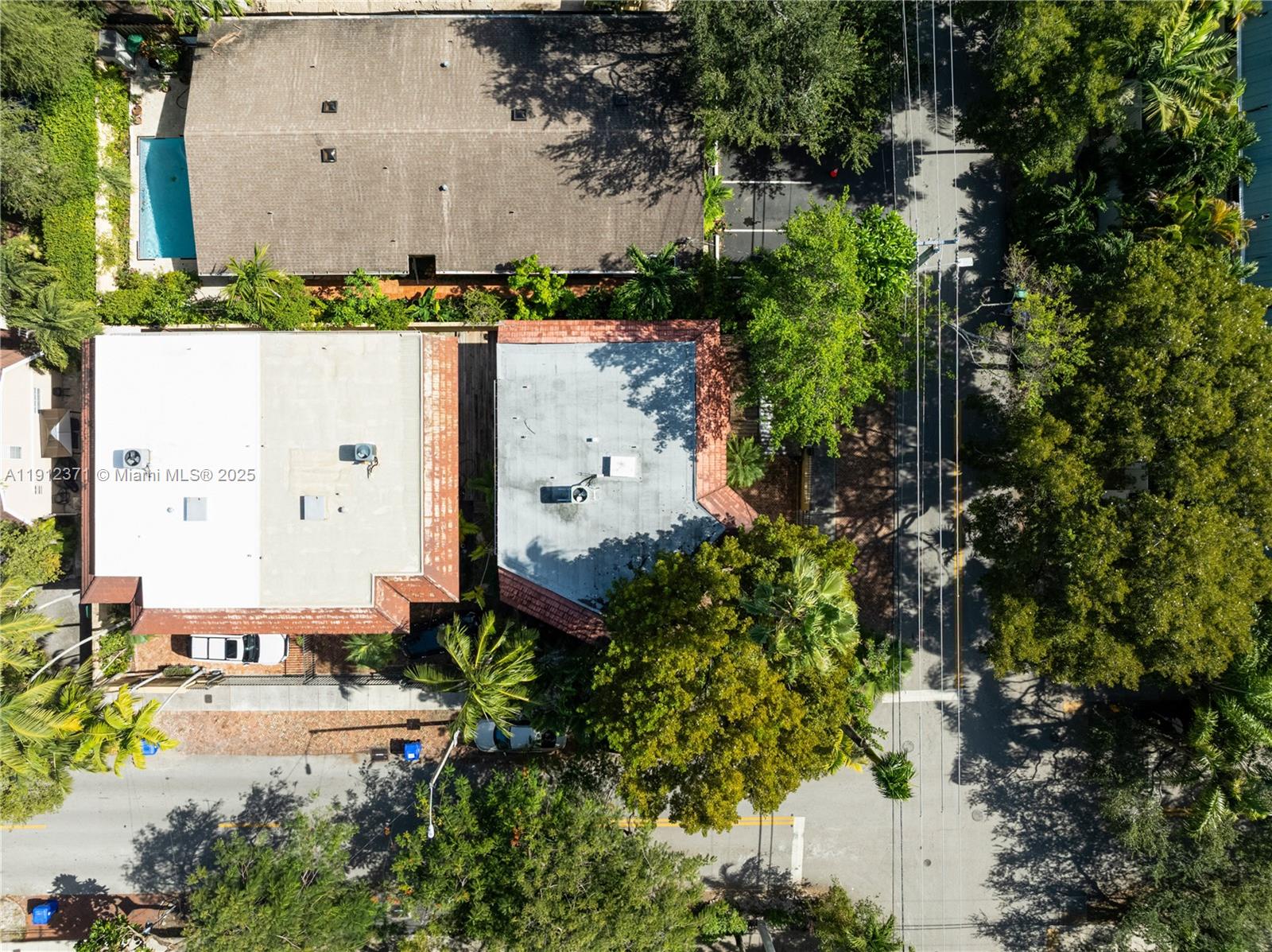 2997 Day Avenue Miami, FL 33133 - Photo 14 of 15 an aerial view of a house with a yard and trees