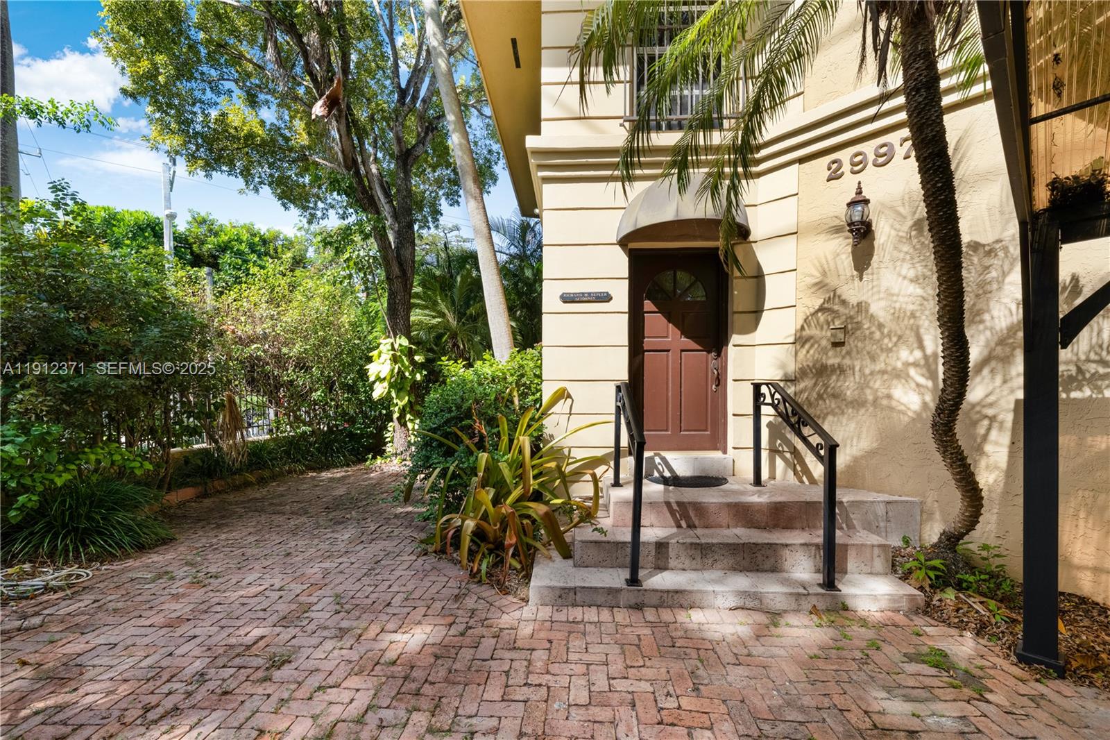 2997 Day Avenue Miami, FL 33133 - Photo 2 of 15 a front view of a house with a yard
