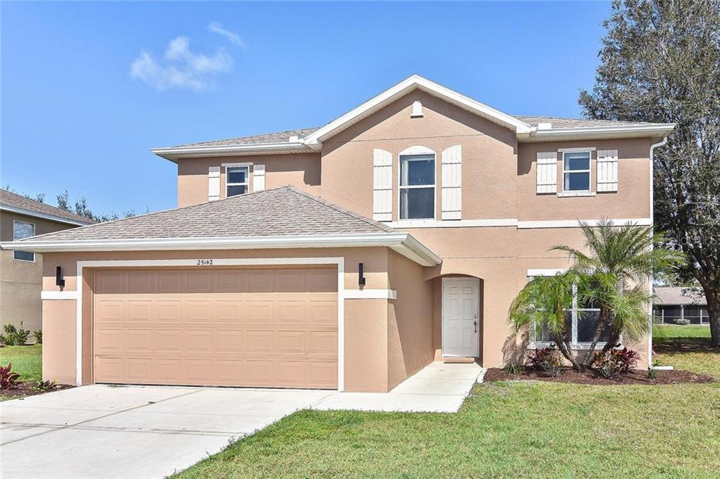 25142 Palisade Road Punta Gorda, FL 33983 - Photo 1 of 1 a front view of a house with a yard
