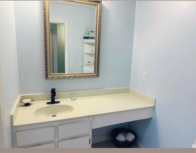 9417 South Ocean Drive, Unit 37 Jensen Beach, FL 34957 - Photo 13 of 18 a bathroom with a sink and a toilet