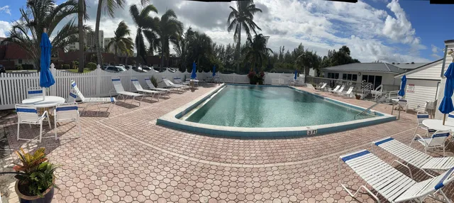 a view of a park with iron fence