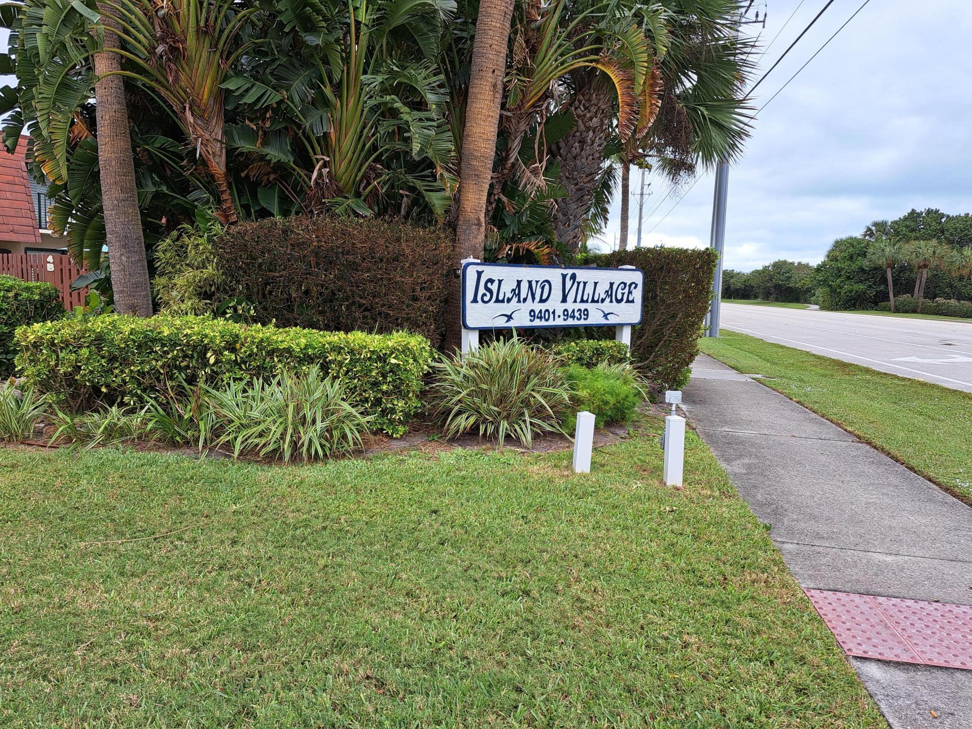 9417 South Ocean Drive, Unit 37 Jensen Beach, FL 34957 - Photo 2 of 18 a view of a street with palm trees