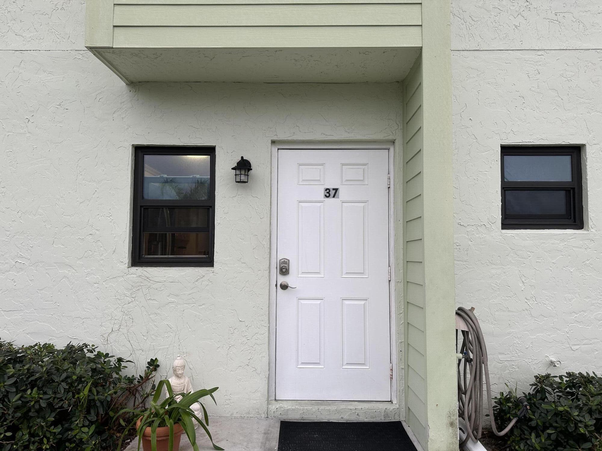 9417 South Ocean Drive, Unit 37 Jensen Beach, FL 34957 - Photo 3 of 18 a view of front door of house