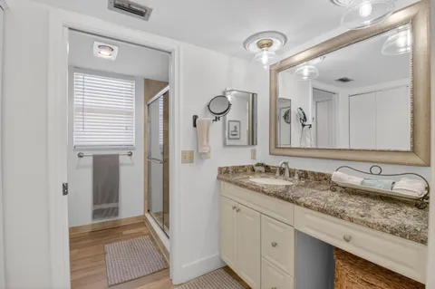 a view of a city from a balcony with furniture