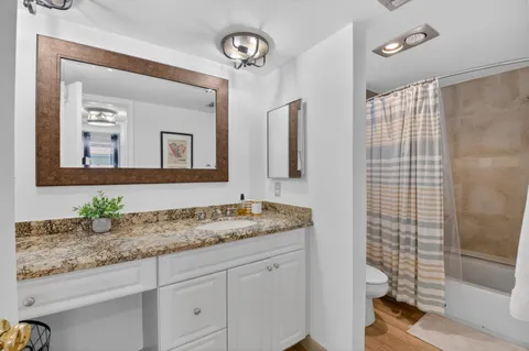 an aerial view of residential houses with outdoor space and swimming pool