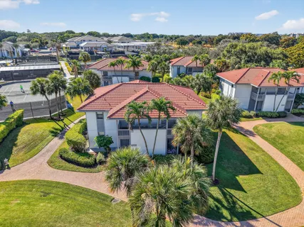 a living room with lots of furniture and a chandelier