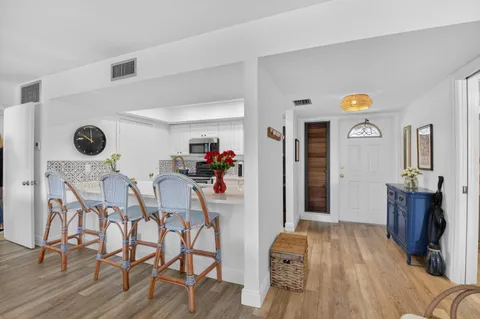 a view of dining room and wooden floor