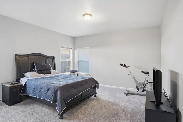a spacious bathroom with a shower sink and mirror