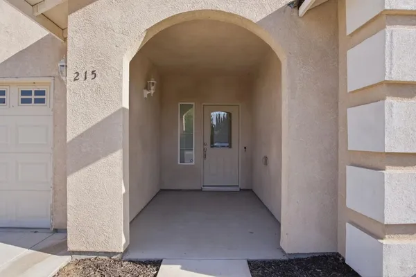 a view of a hallway with windows