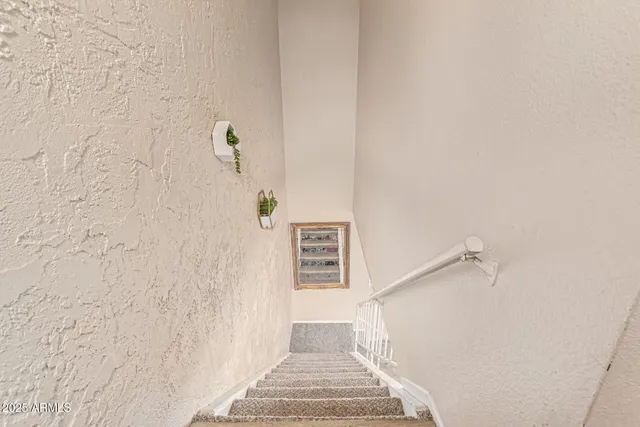 a view of a hallway with stairs