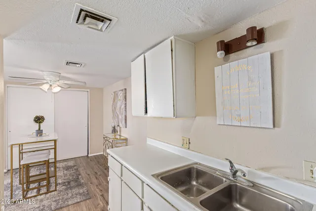 a kitchen with a sink and a refrigerator