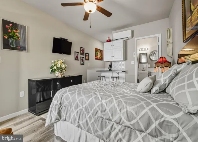 a bedroom with a bed and a tv