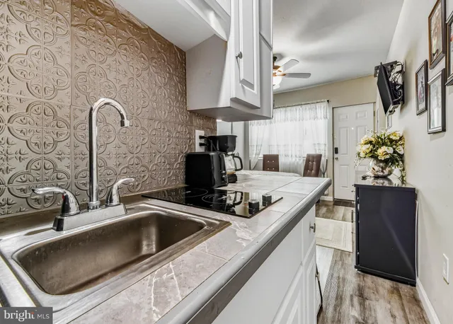 a kitchen with a sink and a refrigerator