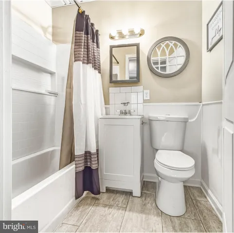 a bathroom with a toilet and a sink