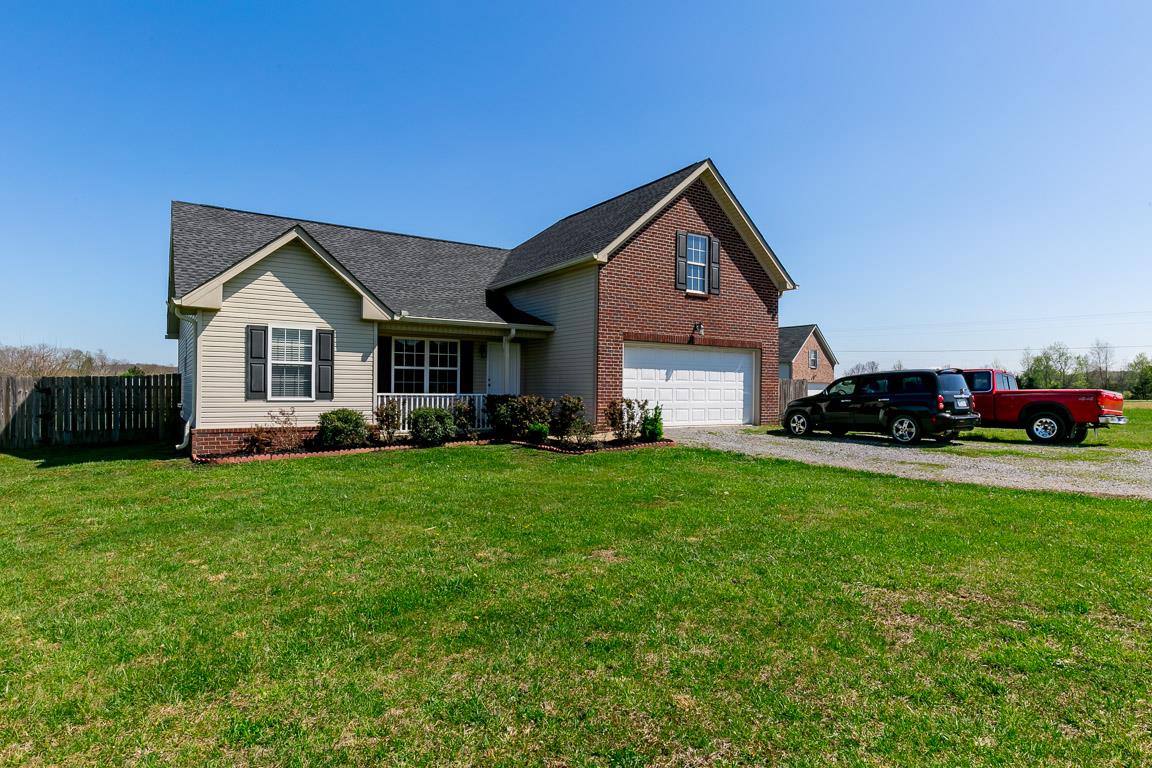 4829 Alsup Mill Road Lascassas, TN 37085 - Photo 1 of 19 a front view of a house with a garden