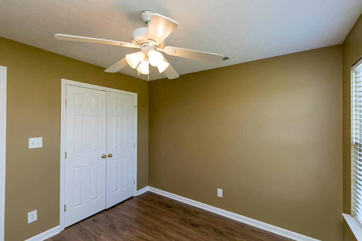 4829 Alsup Mill Road Lascassas, TN 37085 - Photo 11 of 19 an empty room with a window and wooden floor