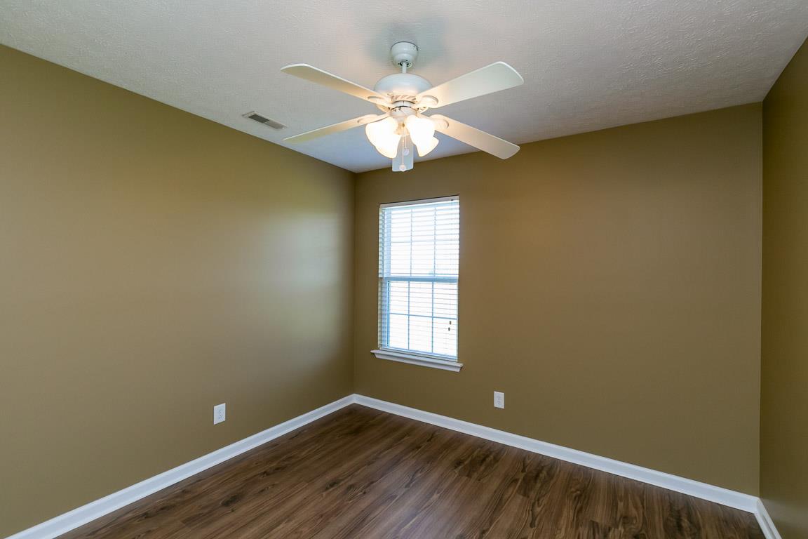 4829 Alsup Mill Road Lascassas, TN 37085 - Photo 9 of 19 a view of an empty room with window and wooden floor