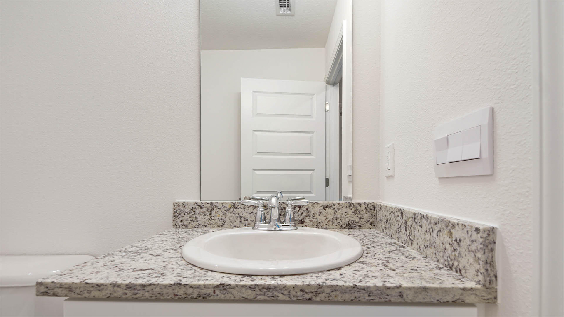 59 Foxtrail Run Freeport, FL 32439 - Photo 19 of 20 a bathroom with a granite countertop sink and a mirror
