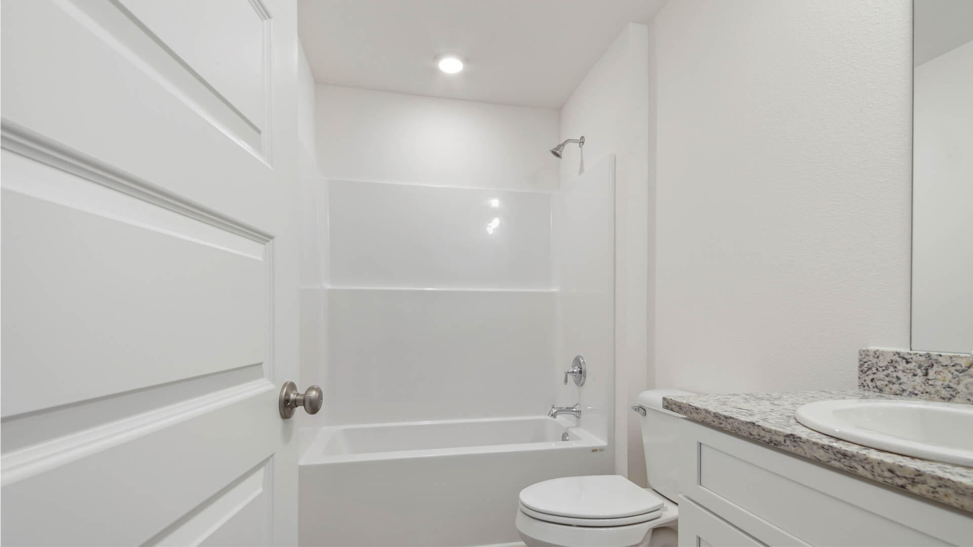 59 Foxtrail Run Freeport, FL 32439 - Photo 20 of 20 a bathroom with a granite countertop bathtub shower sink vanity mirror and toilet