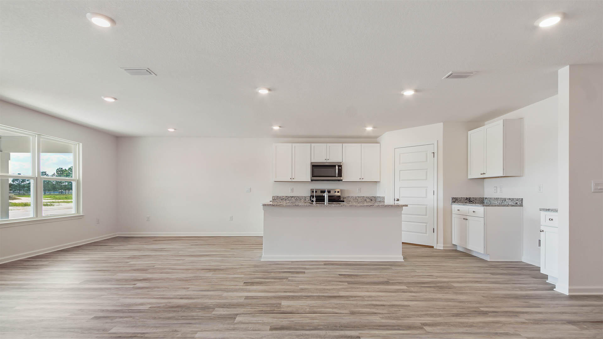 59 Foxtrail Run Freeport, FL 32439 - Photo 4 of 20 a kitchen with stainless steel appliances a refrigerator sink and stove