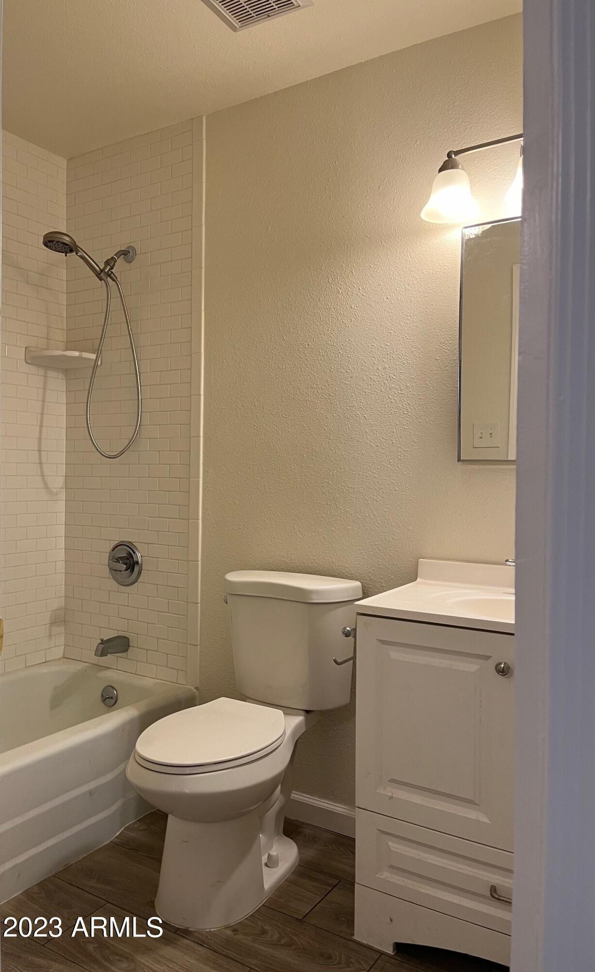 8638 North 8th Street Phoenix, AZ 85020 - Photo 8 of 12 a white toilet sitting next to a bath tub and a shower