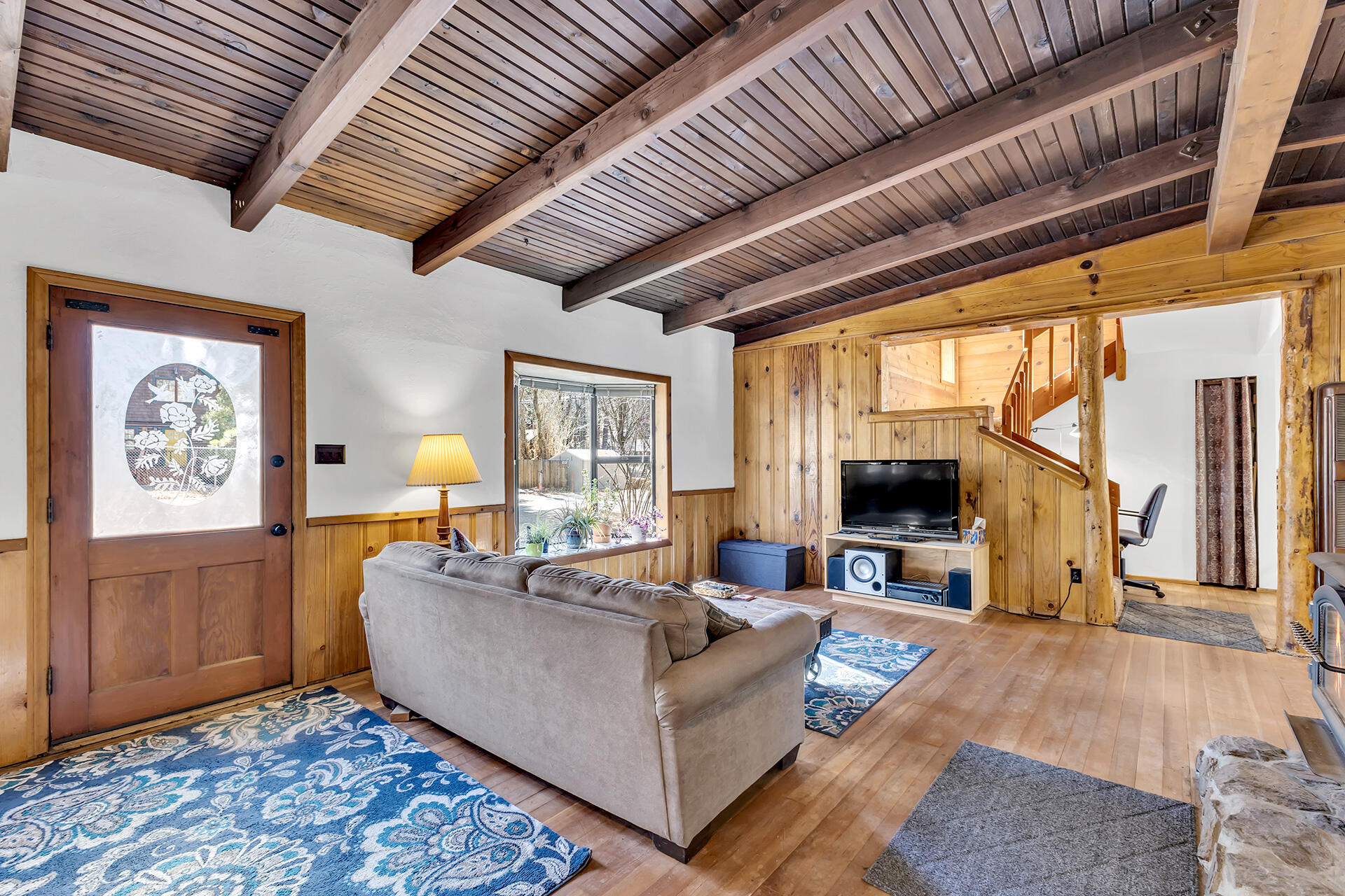 53340 Idyllbrook Drive Idyllwild, CA 92549 - Photo 13 of 68 a living room with furniture and a flat screen tv