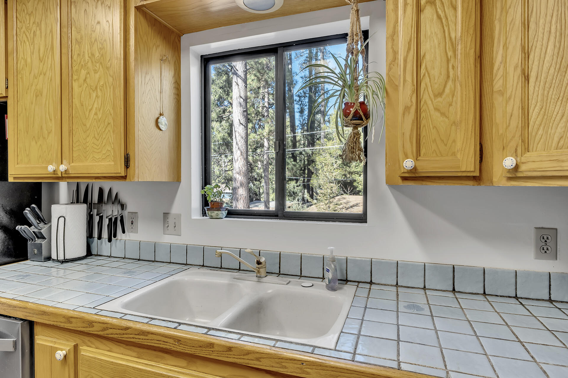53340 Idyllbrook Drive Idyllwild, CA 92549 - Photo 22 of 68 a kitchen with a sink and large window