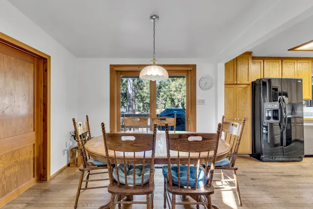a view of a lake from a balcony with seating space
