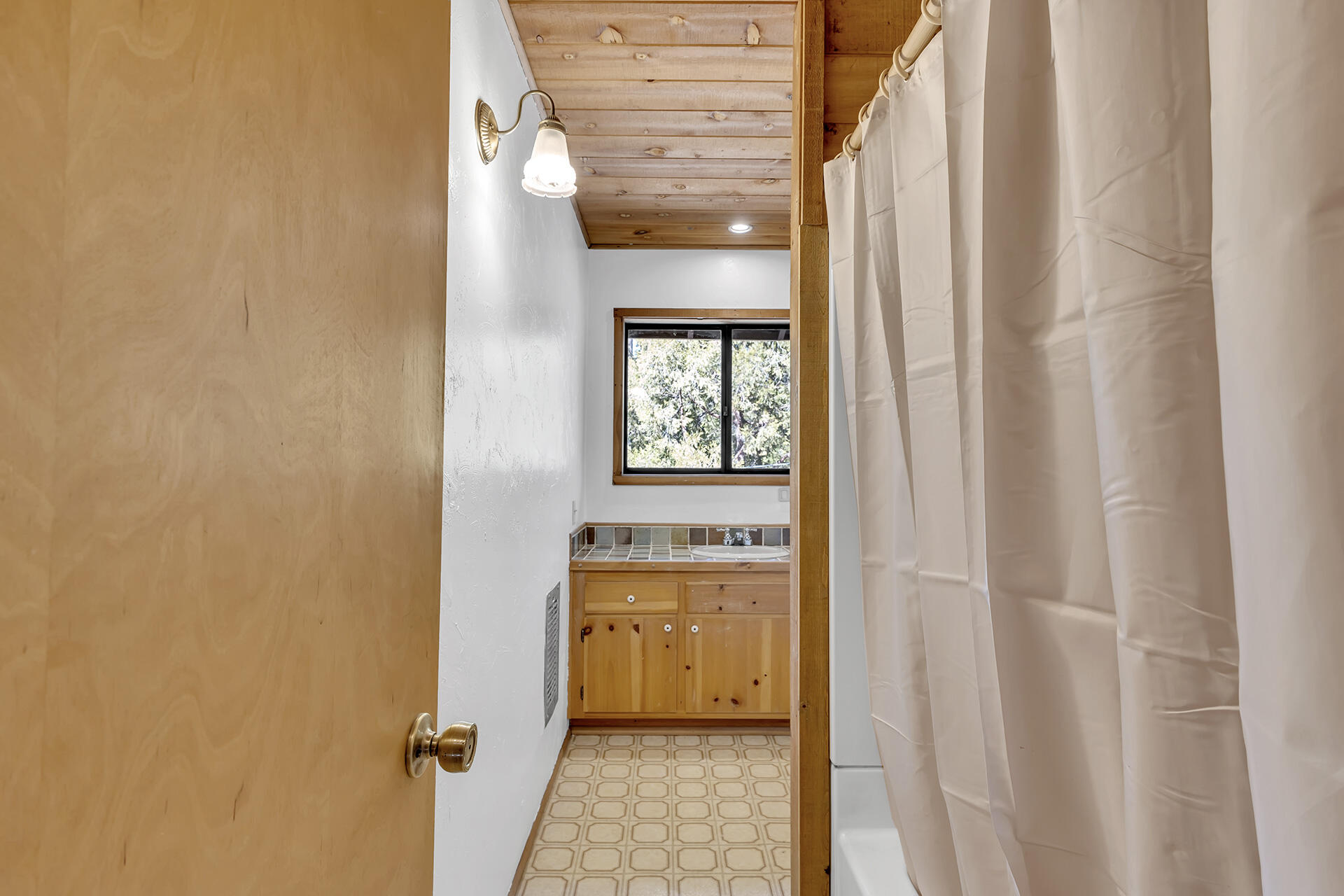 53340 Idyllbrook Drive Idyllwild, CA 92549 - Photo 55 of 68 a bathroom with a sink and a mirror
