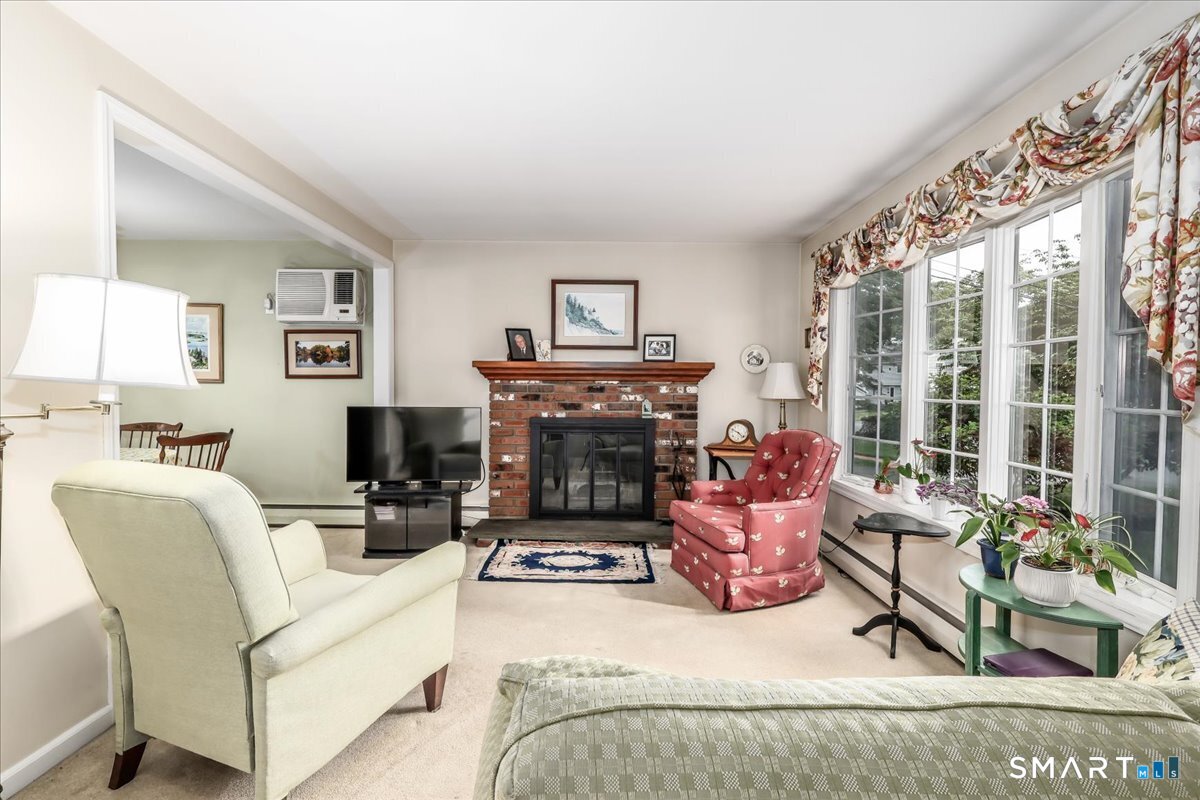 75 Centerbrook Road Fairfield, CT 06824 - Photo 6 of 39 LR w/woodburning fpl, large bow window. Hardwood under carpet
