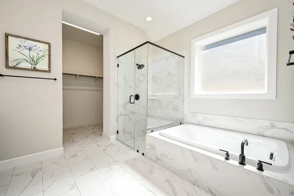 a bathroom with a sink double vanity and a shower