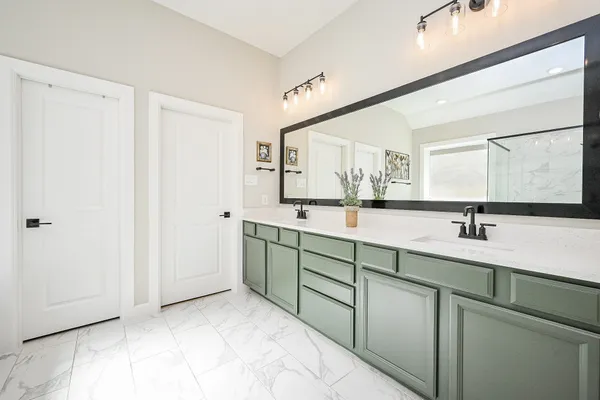 a bathroom with a bathtub and a shower