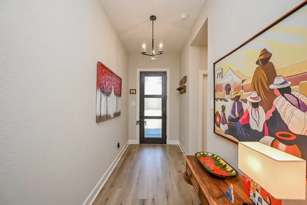 a view of gallery with wooden floor