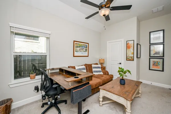 a living room with furniture and a window