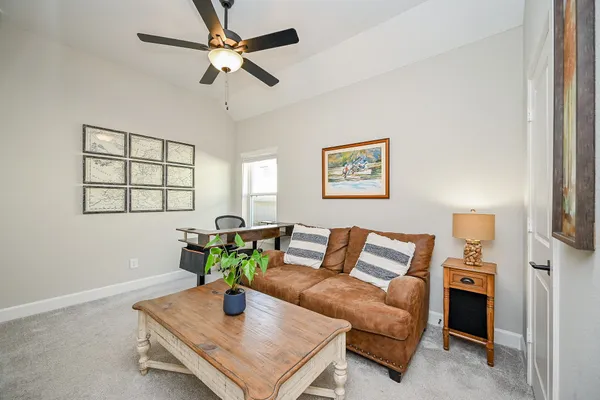 a living room with furniture and a window