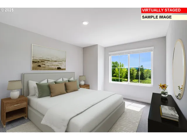 a bedroom with a bed and a large window