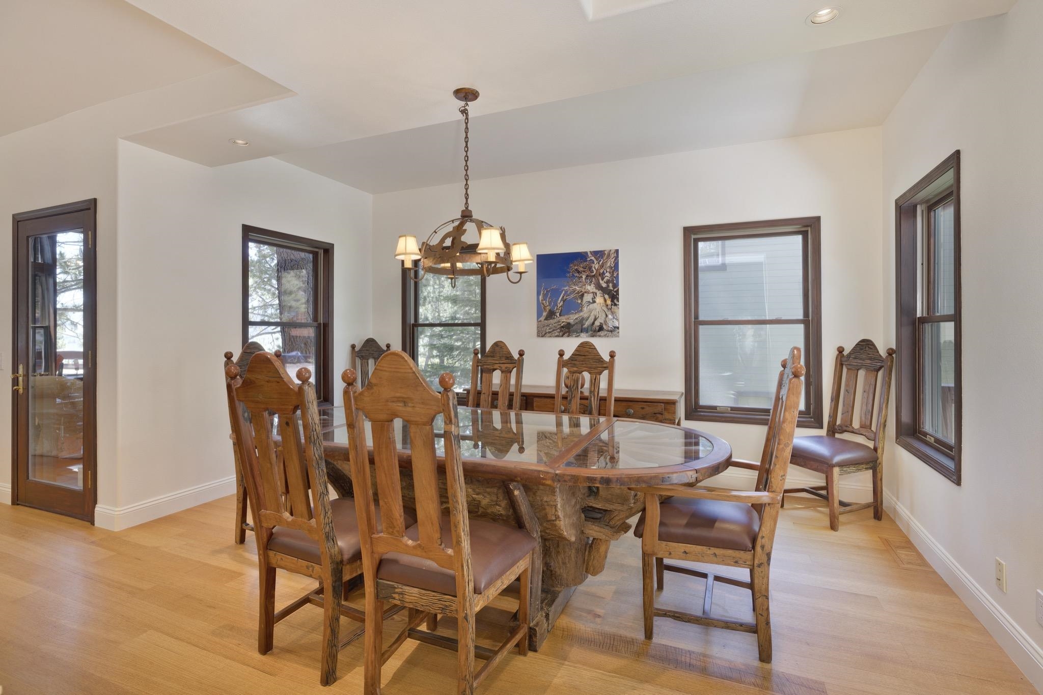 378 Ridge Way Mammoth Lakes, CA 93546 - Photo 18 of 43 Dining area featuring light wood-finish flooring, white walls, and dark wood-framed windows