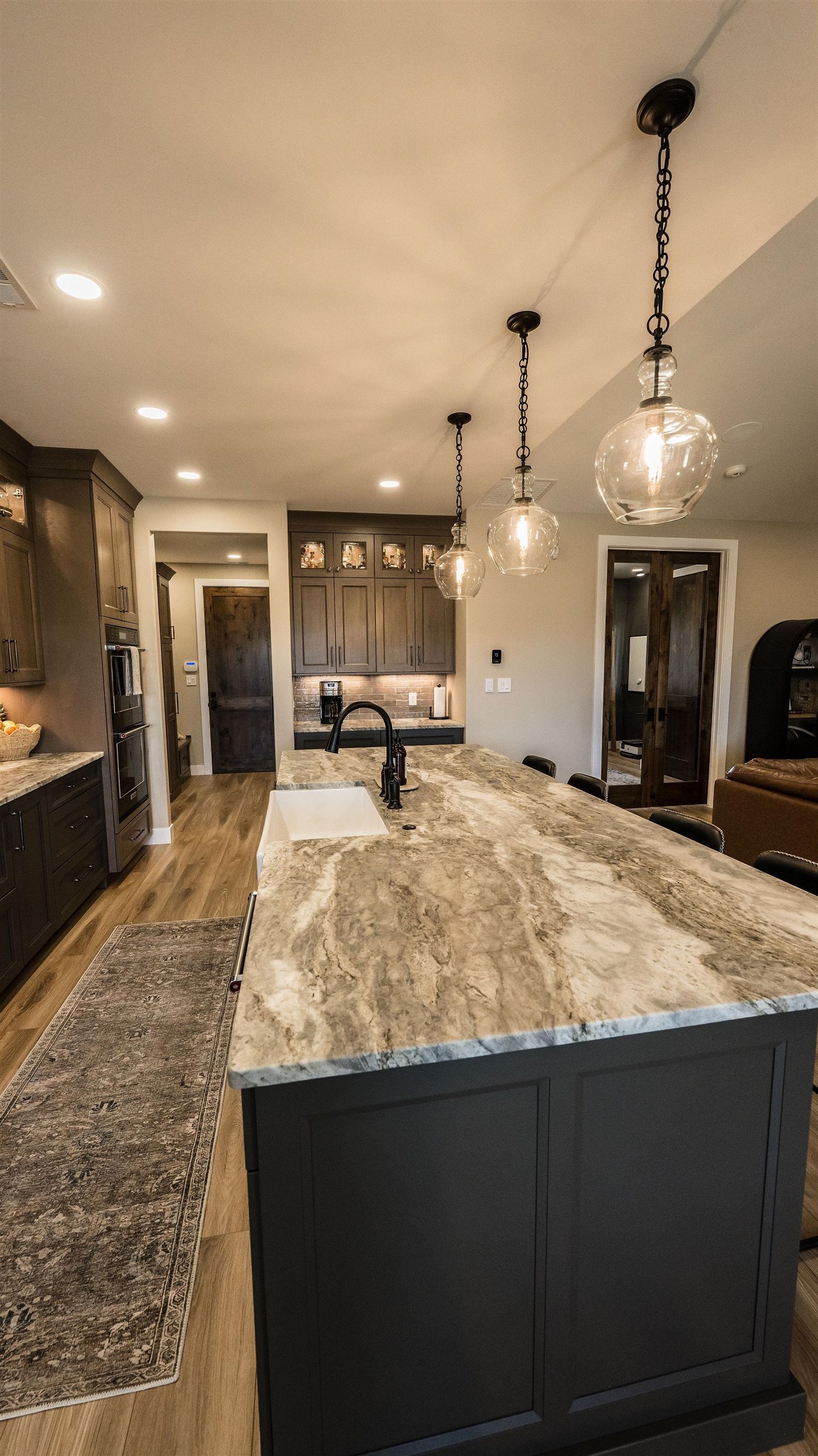 2639 Emerald Ridge Lane Grand Junction, CO 81506 - Photo 8 of 42 a large kitchen with kitchen island a sink stainless steel appliances and a chandelier