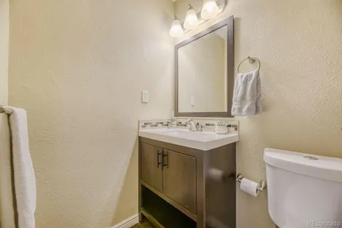 a view of bathroom with a sink and a toilet