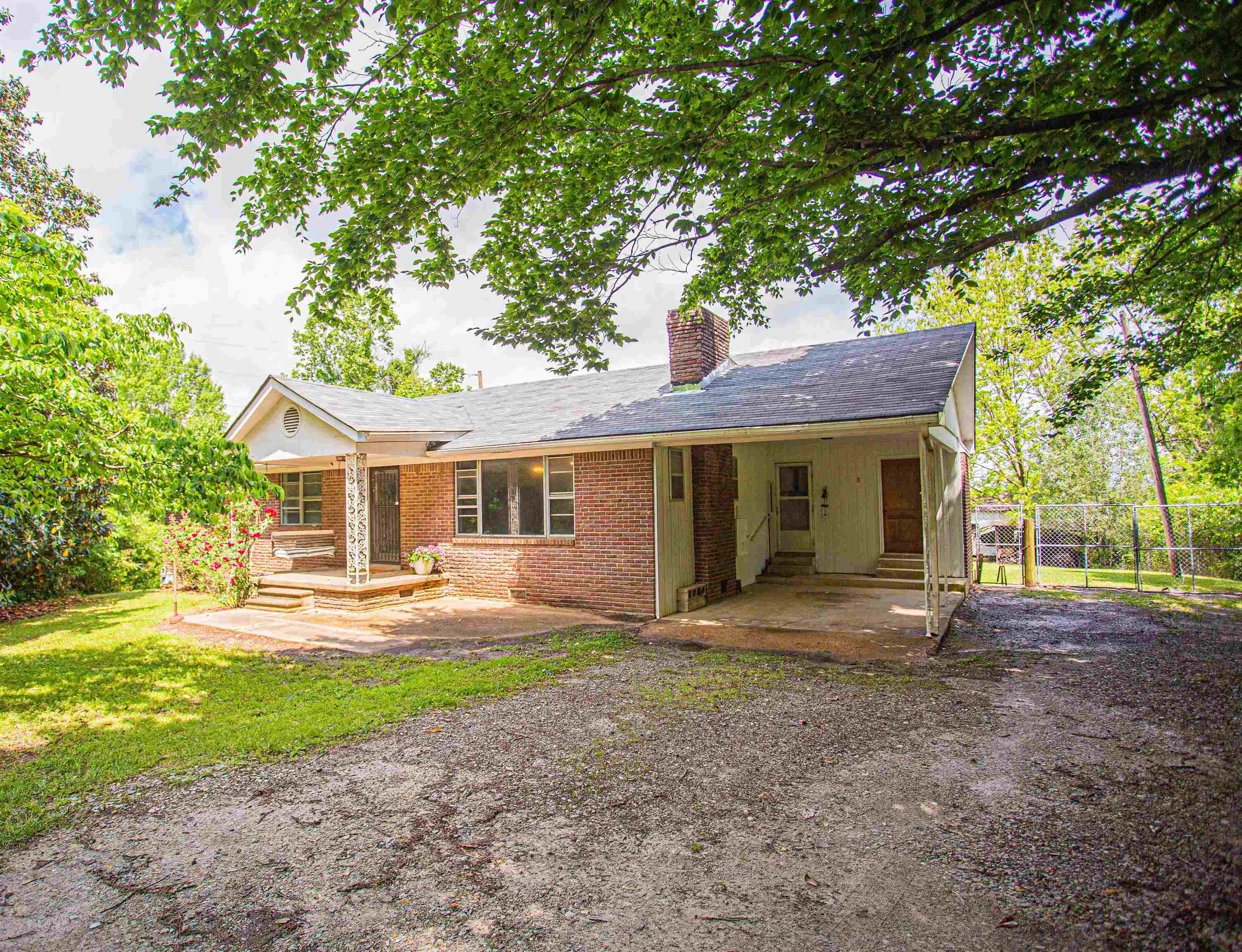 6223 Conner Whitefield Road Ripley, TN 38063 - Photo 1 of 35 a front view of a house with a yard and trees