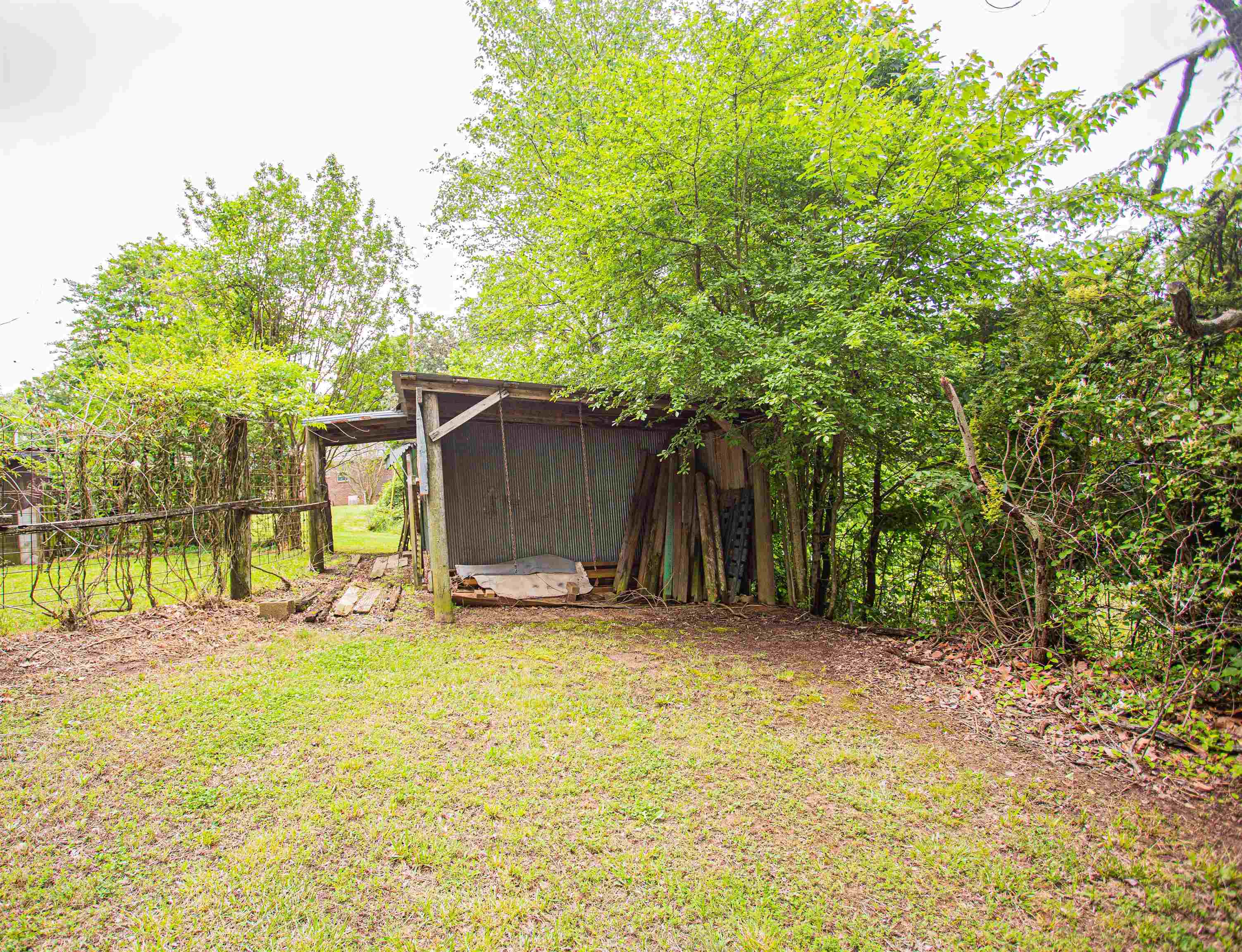 6223 Conner Whitefield Road Ripley, TN 38063 - Photo 27 of 35 a backyard of a house with table and chairs