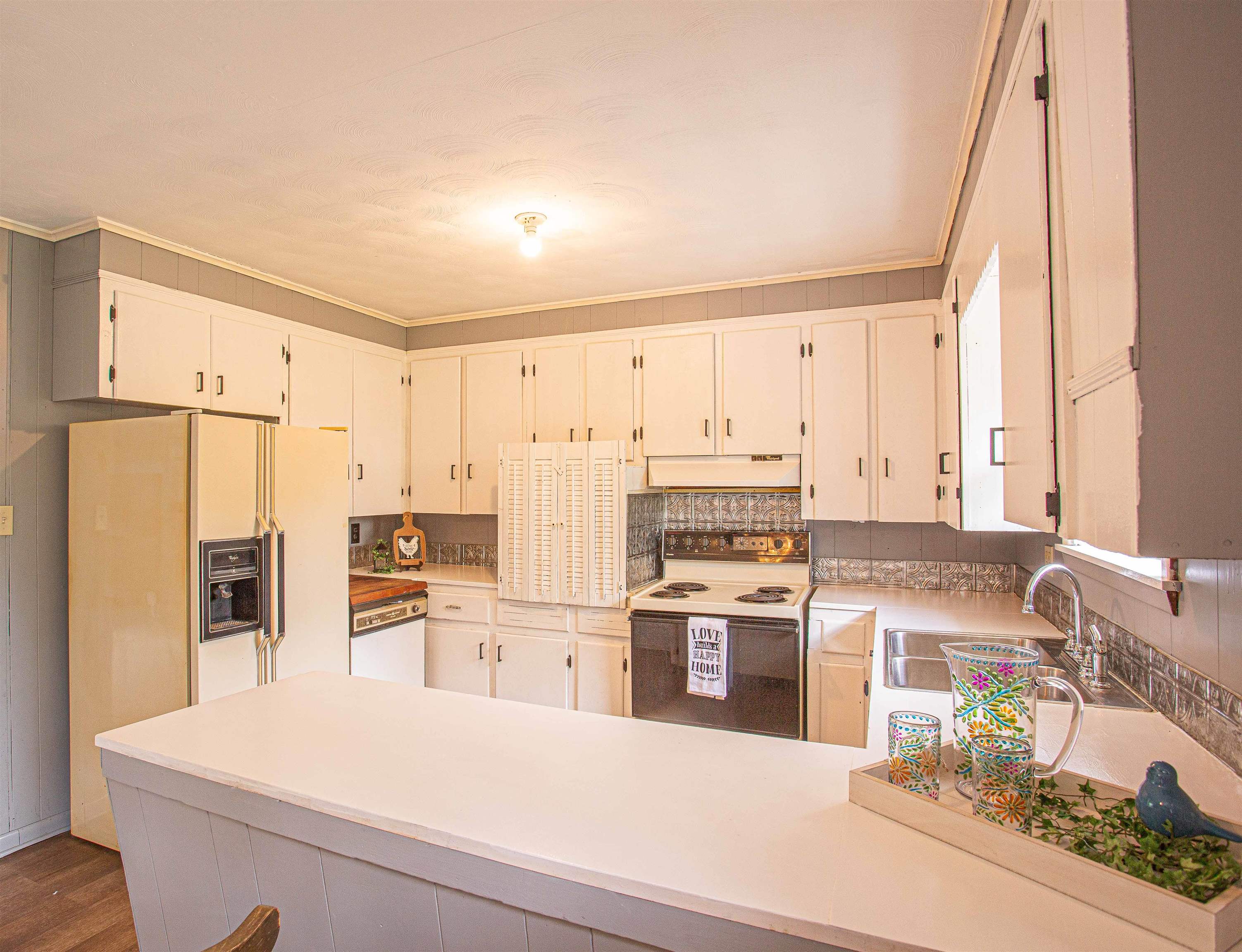 6223 Conner Whitefield Road Ripley, TN 38063 - Photo 7 of 35 a kitchen with stainless steel appliances a stove a sink and a refrigerator