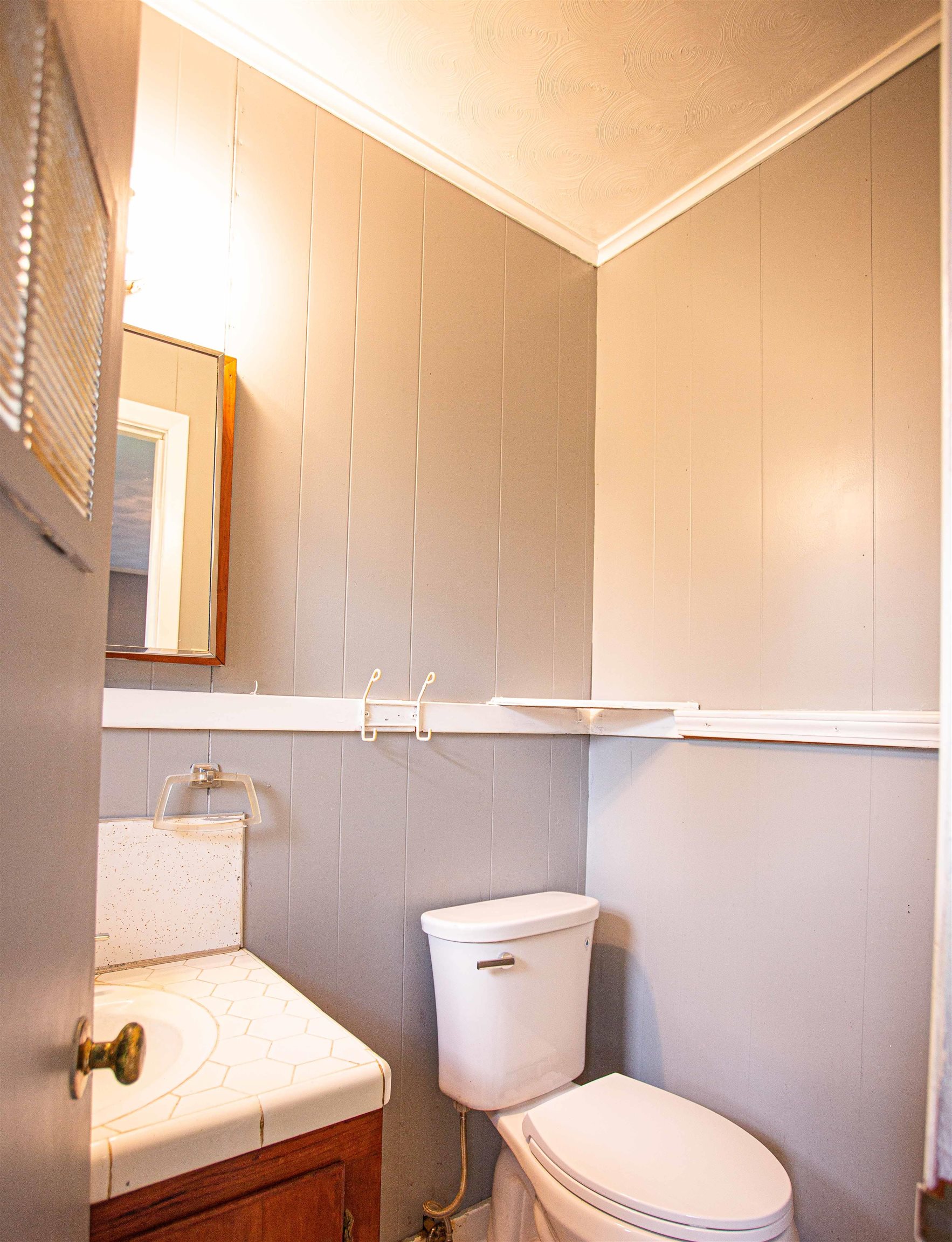 6223 Conner Whitefield Road Ripley, TN 38063 - Photo 10 of 35 a bathroom with a toilet a sink and a window