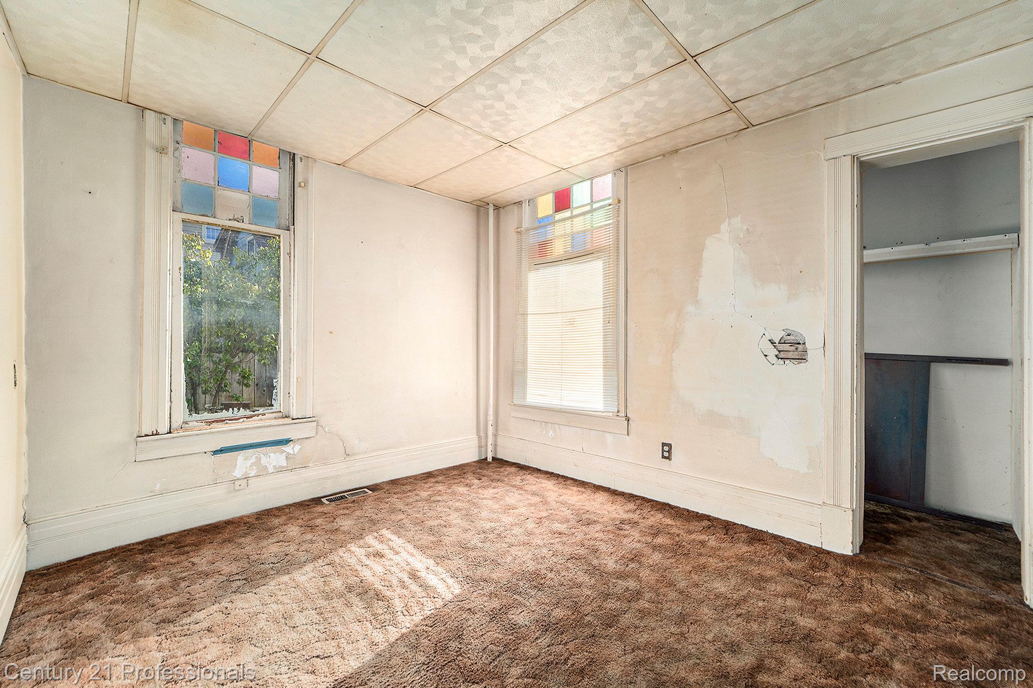 428 East Street Rochester, MI 48307 - Photo 23 of 30 Unfurnished bedroom featuring a paneled ceiling, carpet floors, and multiple windows