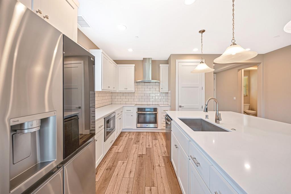 504 Chase Court Colfax, CA 95713 - Photo 37 of 94 a kitchen with a sink stove and refrigerator