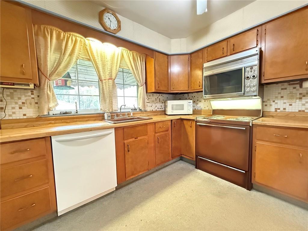 123 Hadley Road Greenville, PA 16125 - Photo 29 of 49 a kitchen with a sink stove and cabinets