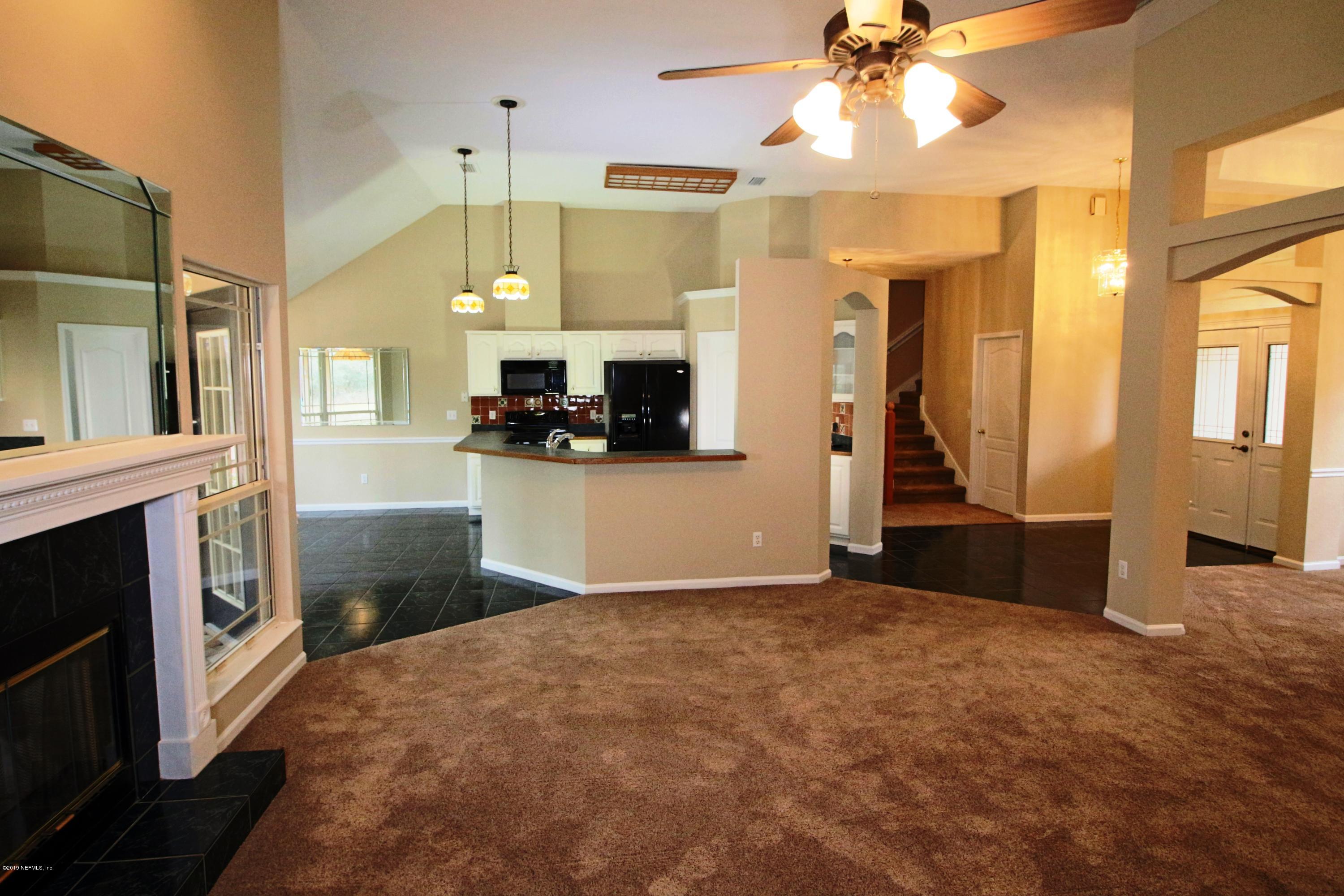 6055 Trawick Road Keystone Heights, FL 32656 - Photo 13 of 60 12) Living to Kitchen
