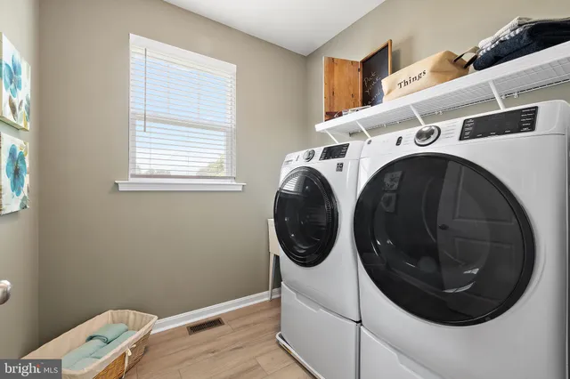a view of a wooden bench and chair