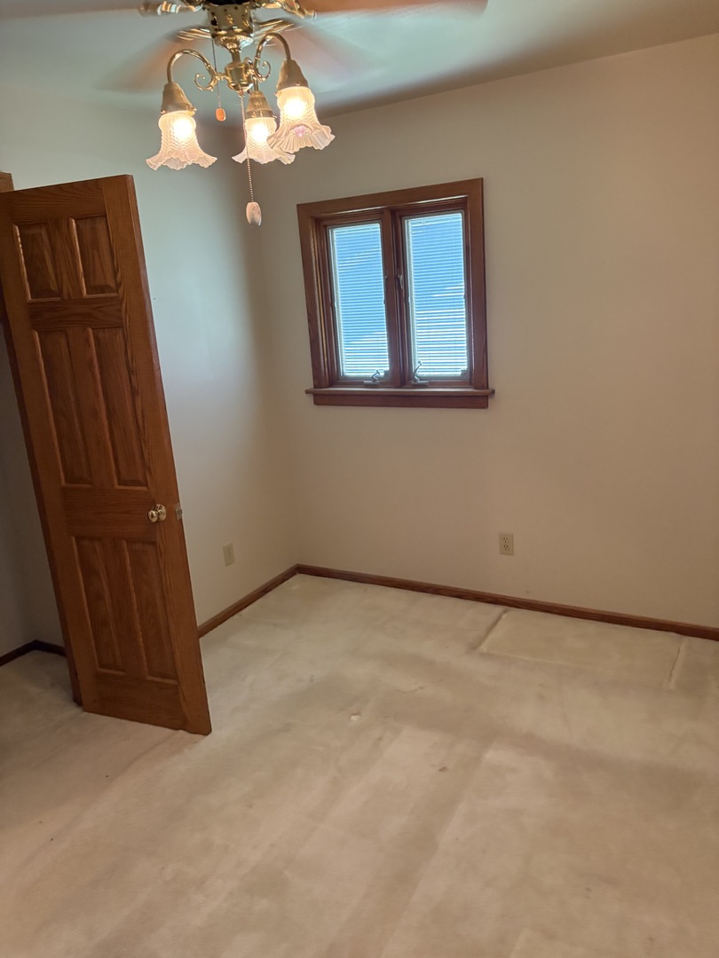 1707 Wright Street Streator, IL 61364 - Photo 8 of 9 a view of an empty room with a window